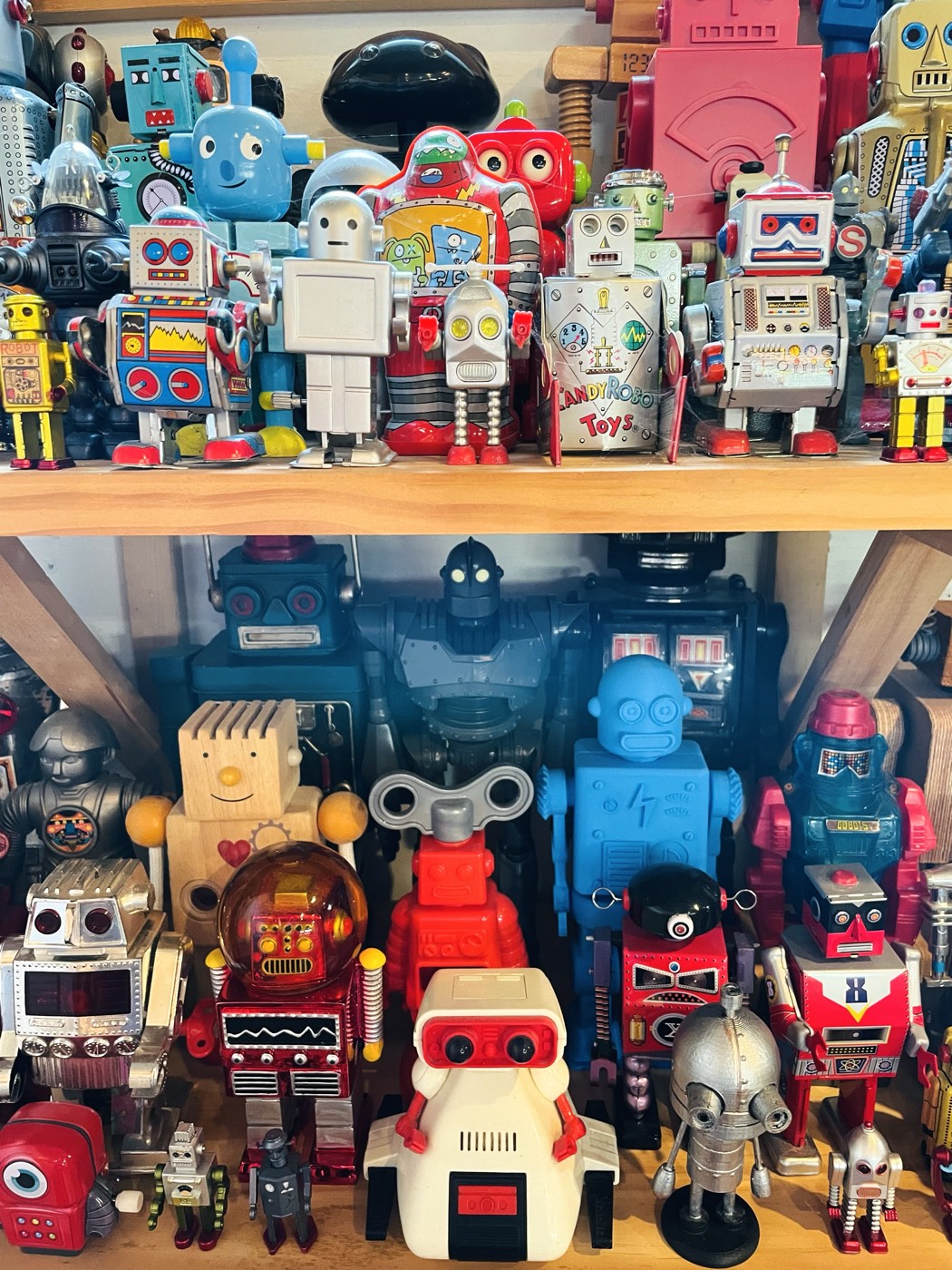 A shelf of vintage toy robots in the studio