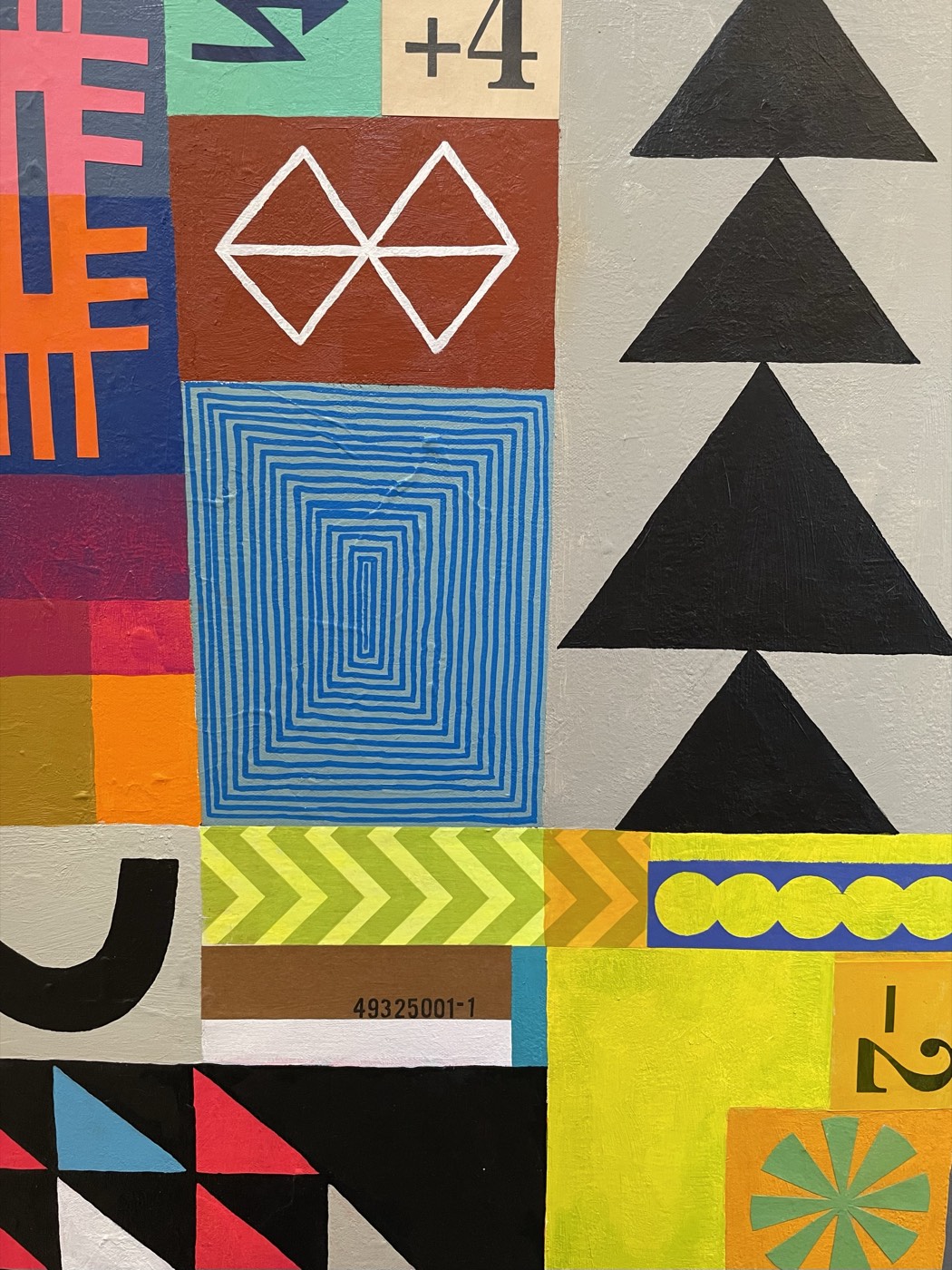 Detail of a colorful geometric painting with triangles and stripes