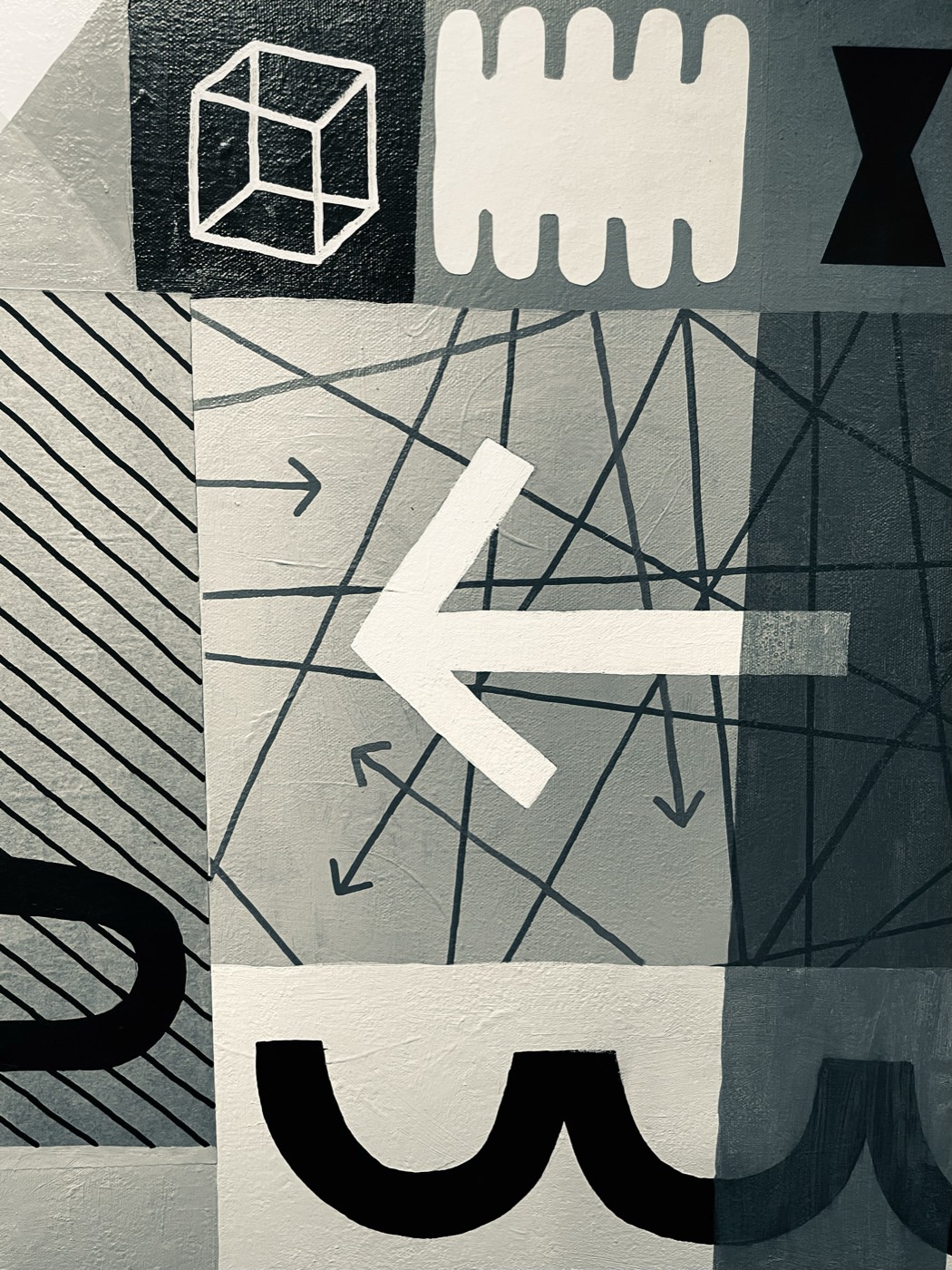 Detail of a black-and-white abstract painting with arrows and crossing lines
